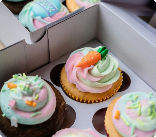 Image of cupcakes in a box as an example of Food and Grocery that can be sent with Sherpa
